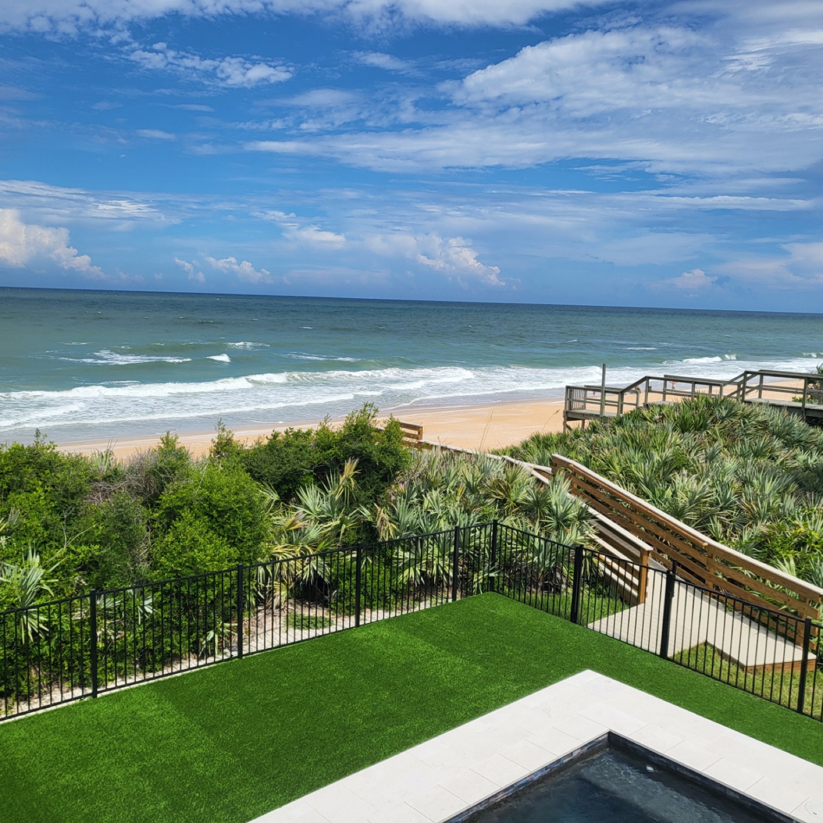 Atlantic Ocean and beach beyond the lawn at Salty Dog Lodge