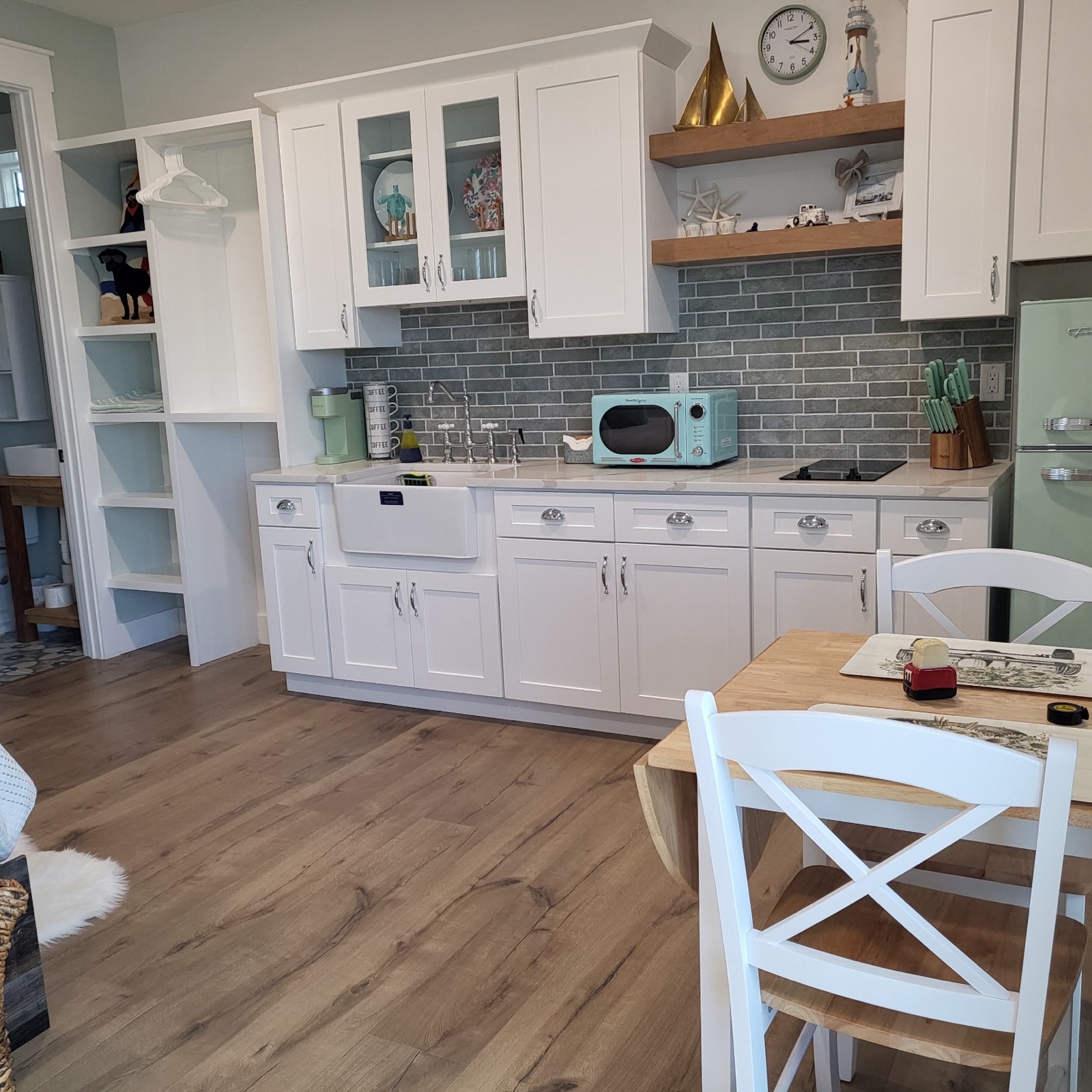 Farmhouse kitchenette with quartz counters in Unit 1